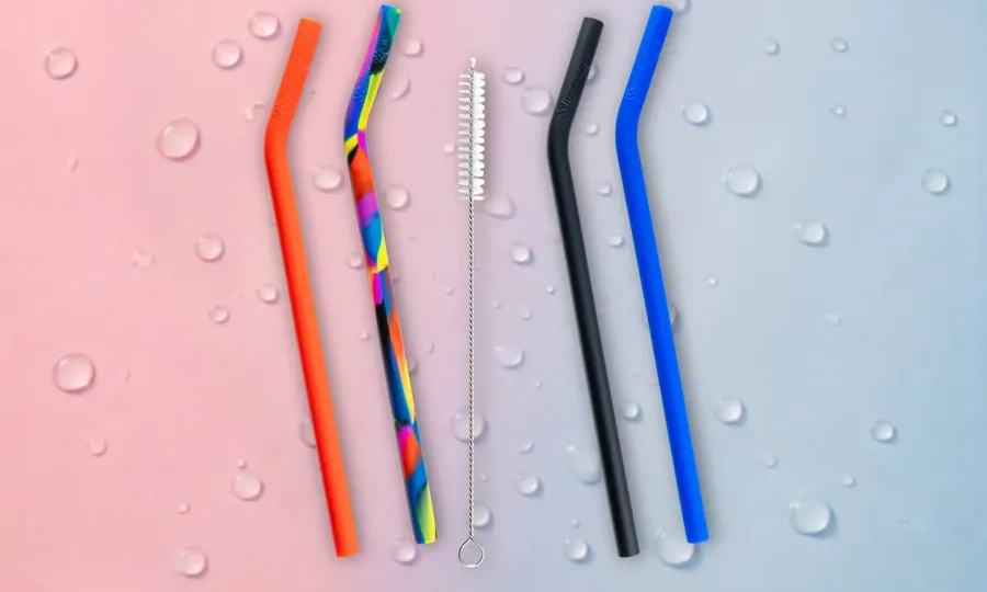 Strawtastik's four straws and cleaning brush, laid flat